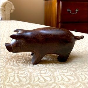 Hand carved iron wood pig.  Beautiful addition to any home.  Tip of tail broken.